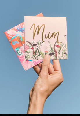 Hand holding Mother’s Day gift cards. Shop all gift cards. 