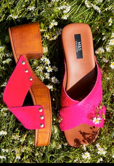 Women’s hot pink pony-hair clog sandals. Shop now. 