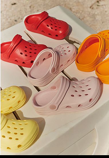 A selection of kids’ clogs in different colours. Shop kids’ clogs