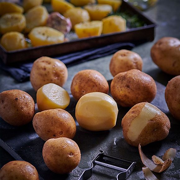 Potatoes being peeled