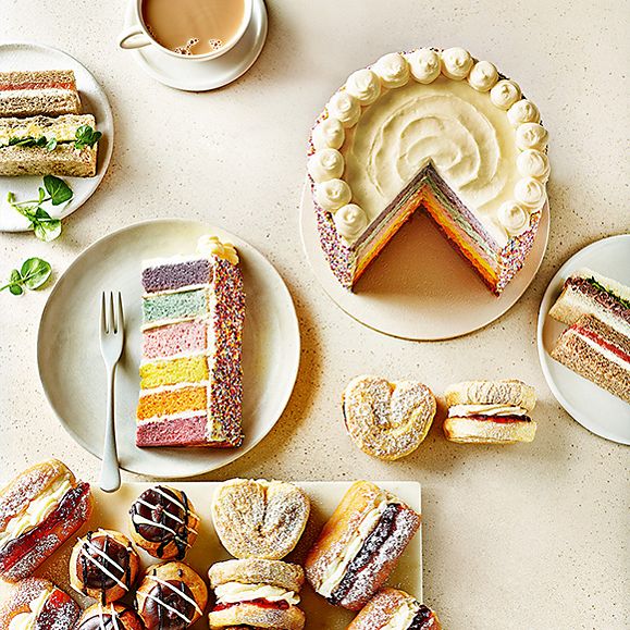 A selection of cakes and sandwiches