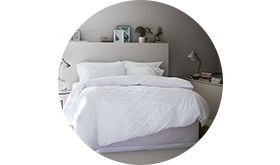 Plain white bedding on a double bed