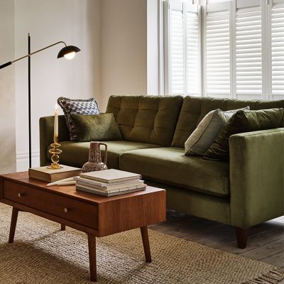 Olive green sofa in modern living room. Shop now