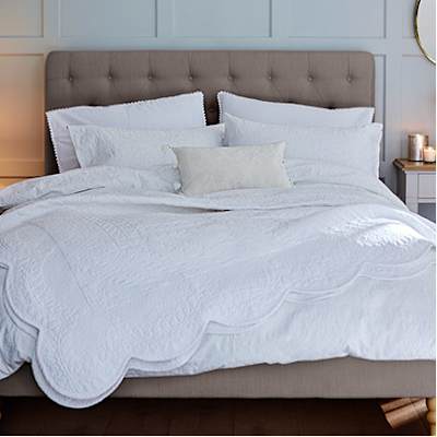 Bed with white luxury bedding