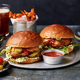 Two buffalo chicken burgers on plate