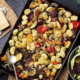 Pan filled with crispy gnocchi Mediterranean vegetables and blue cheese