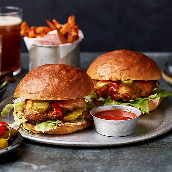 Two buffalo chicken burgers on plate