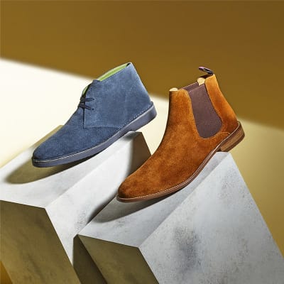 Men’s blue desert boots and tan Chelsea boots in suede