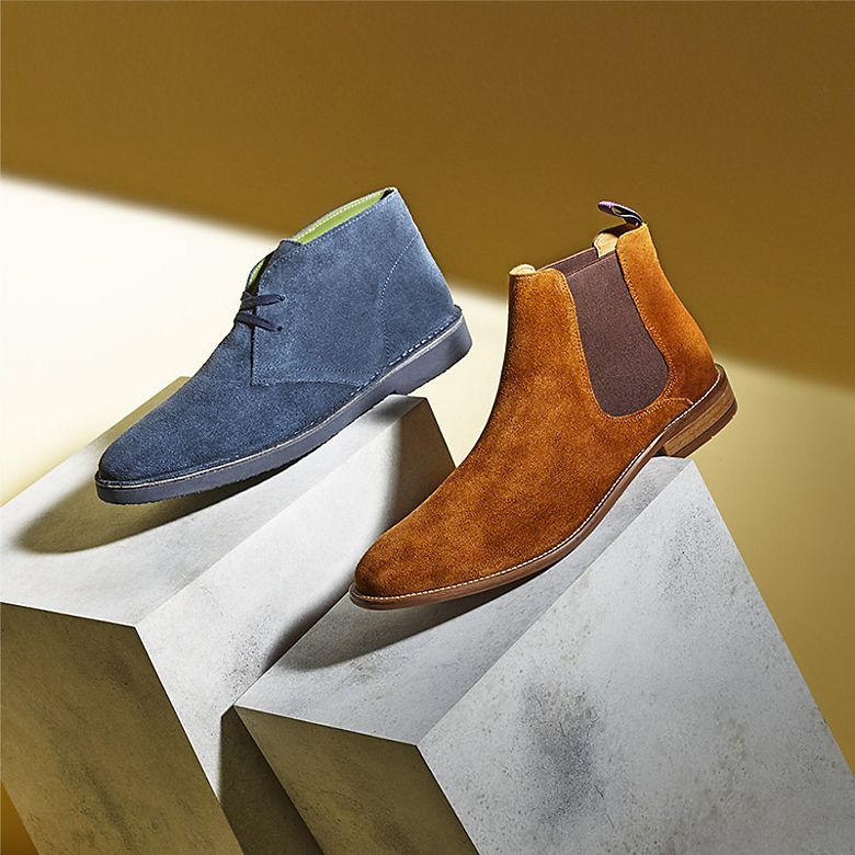 Men’s blue desert boots and tan Chelsea boots in suede