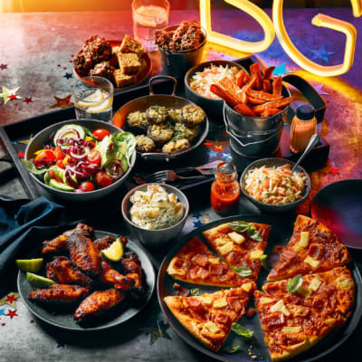 Chicken wings, pizza, salad, sweet treats, sweet potato wedges, coleslaw and condiments