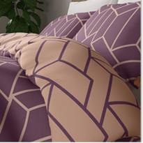 Geometric print reversible bedding in pink and aubergine 