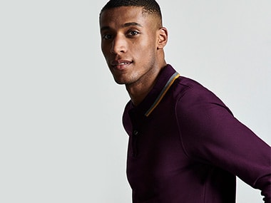 Man wearing purple long-sleeved polo shirt