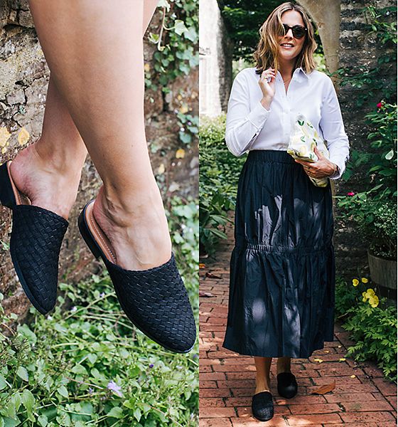 Anna Hart from South Molton St Style wearing a white shirt, black midi skirt, printed clutch and black leather block-heel weave mule sandals