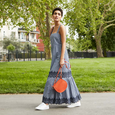 Woman wearing a navy gingham maxi dress