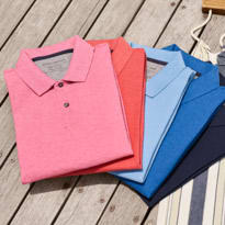 Mens polo shirts laid on decking