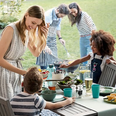 Family and friends having a barbecue in the garden