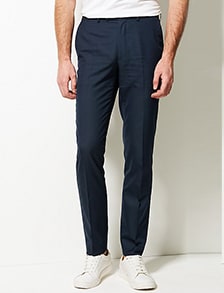 Man wearing navy blue slim-fit trousers