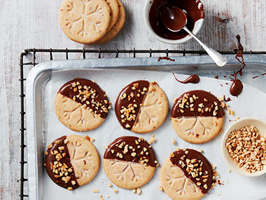 Shortbread dipped in milk chocolate with hazelnuts