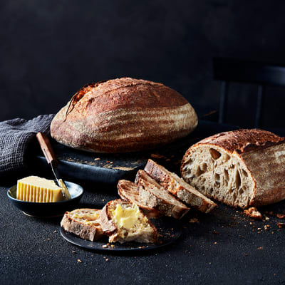 A loaf of sourdough with butter