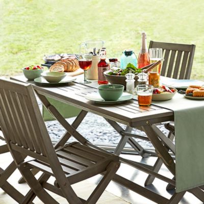 Outdoor table and chairs with food