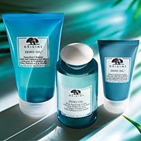 Origins Banish Breakouts surrounded by exotic plant leaves