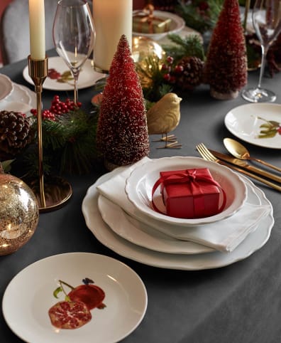 Create a wintry tablescape with white plates and napkins., How to Have the  Most Magical Harry Potter Christmas