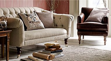 Cream sofa and leather armchair