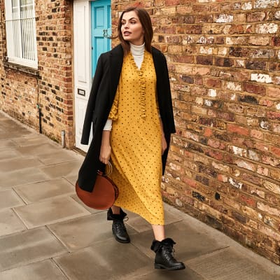 yellow dress with black boots