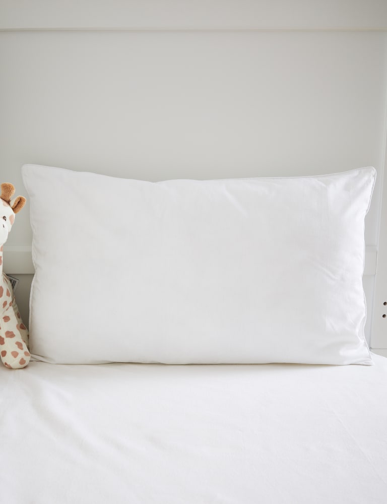 Pillow in cot what age sales