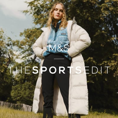  Woman wearing cream coloured padded coat. Shop Columbia