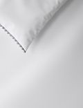 Parure de lit en coton avec bordure à pompons