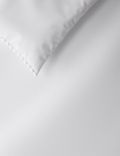Parure de lit en coton avec bordure à pompons