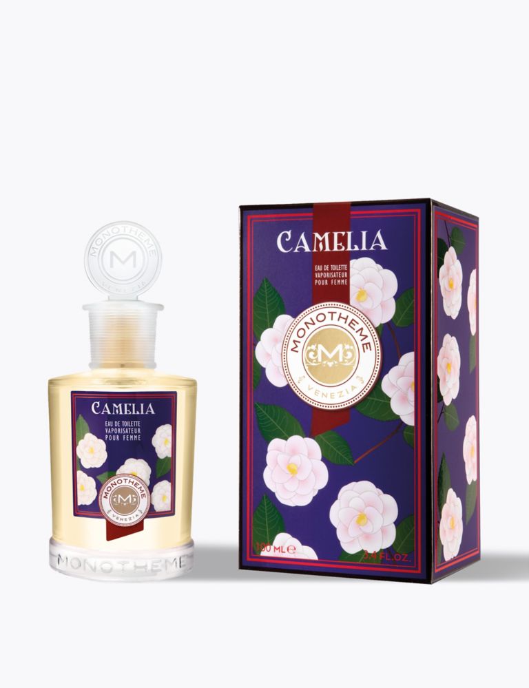Bouteilles D'huile De Camélia Et Fleurs De Camélia Sur Une Table