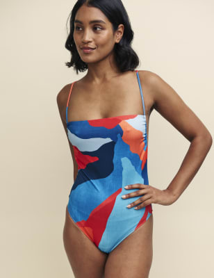 2024 swimwear trends - Bring a bold pop of colour to the pool with this strappy swimsuit from Nobody's Child. It's designed in a comfortable regular fit, with a flattering high-leg cut and a square neck. A scoop back adds a beautifully airy finish