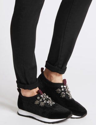 Embellished slip store on trainers