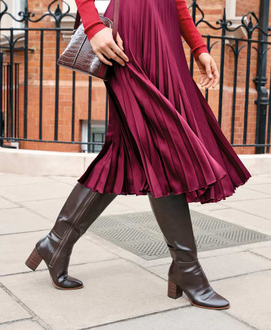 Pleated skirt with knee high boots hotsell