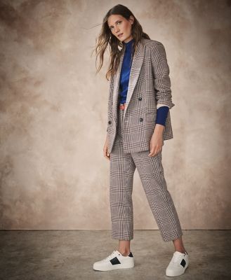 female suit with sneakers