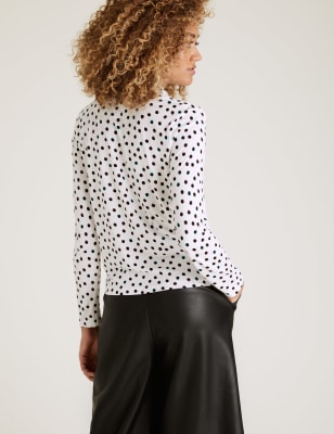 white long sleeve shirt with black polka dots