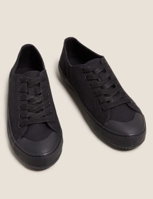 All black store canvas trainers