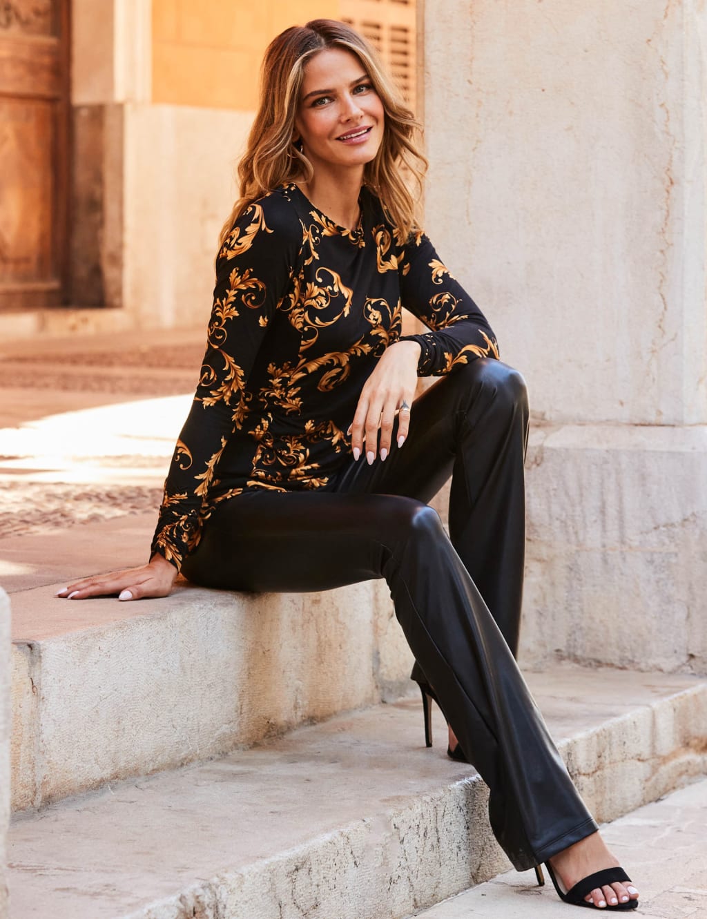 Leather look flared trousers online