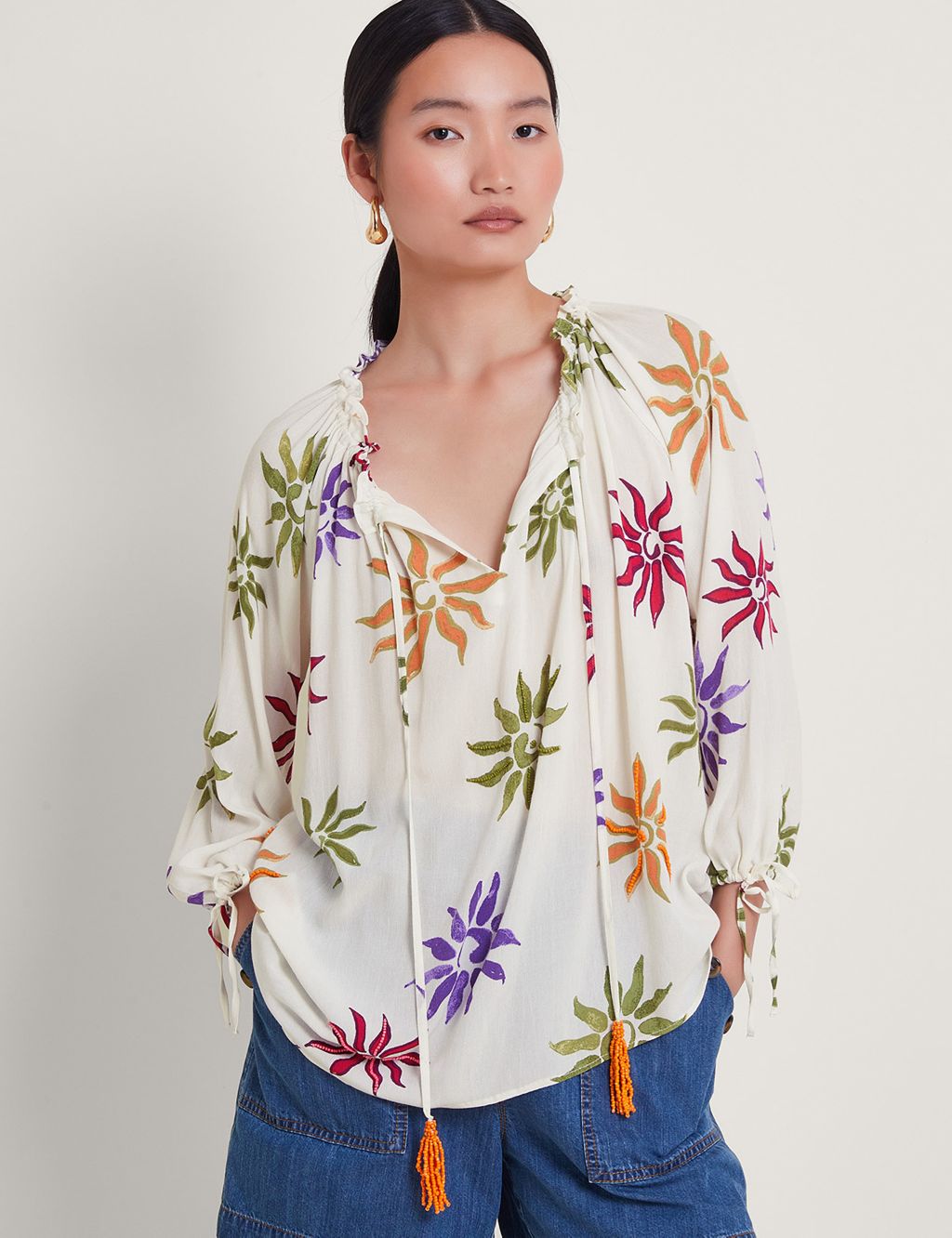 Embroidered Floral Tie Neck Tassel Blouse