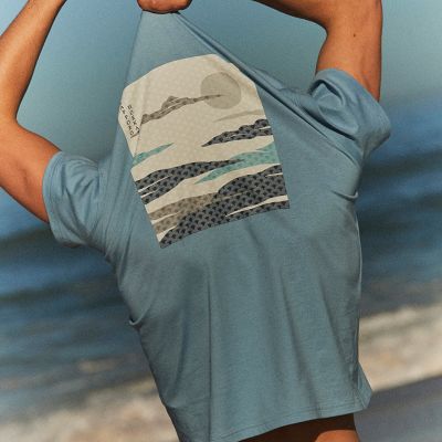 Man wearing T-shirt and swim shorts. Shop men’s Holiday Shop