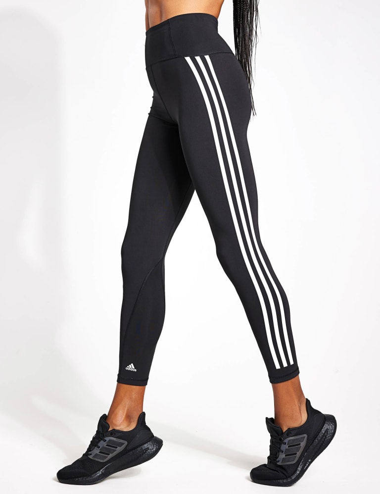 White adidas with black stripes on one side store