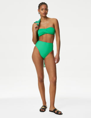 2024 swimwear trends - A twist-front design makes this bikini top a flattering choice. It's crafted in a regular fit, with removable padding for shape and support. The bandeau style is fastened with a clasp at the back and features removable straps so you can style it your way. M&S Collection: versatile styles in modern shapes with unique and playful details.