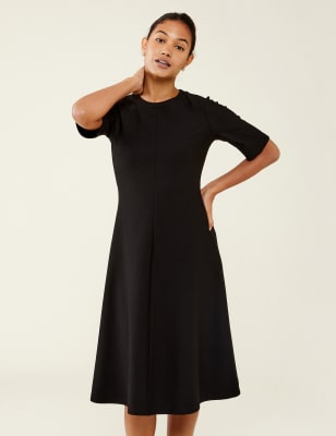 petite black swing dress