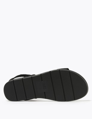 Black elastic sandals online flat