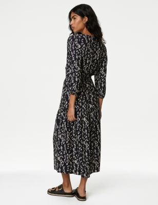 Robe midi imprimée avec encolure à nouer et volants