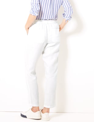 Peg trousers with button ending