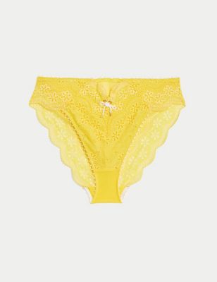 KHARKIV, UKRAINE - September 19, 2019: Label M&S on two lacy pink panties  on white fur. Close up. Fashionable concept of lingerie Stock Photo