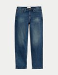 Ruimvallende jeans met vintage wassing en taps toelopende pasvorm
